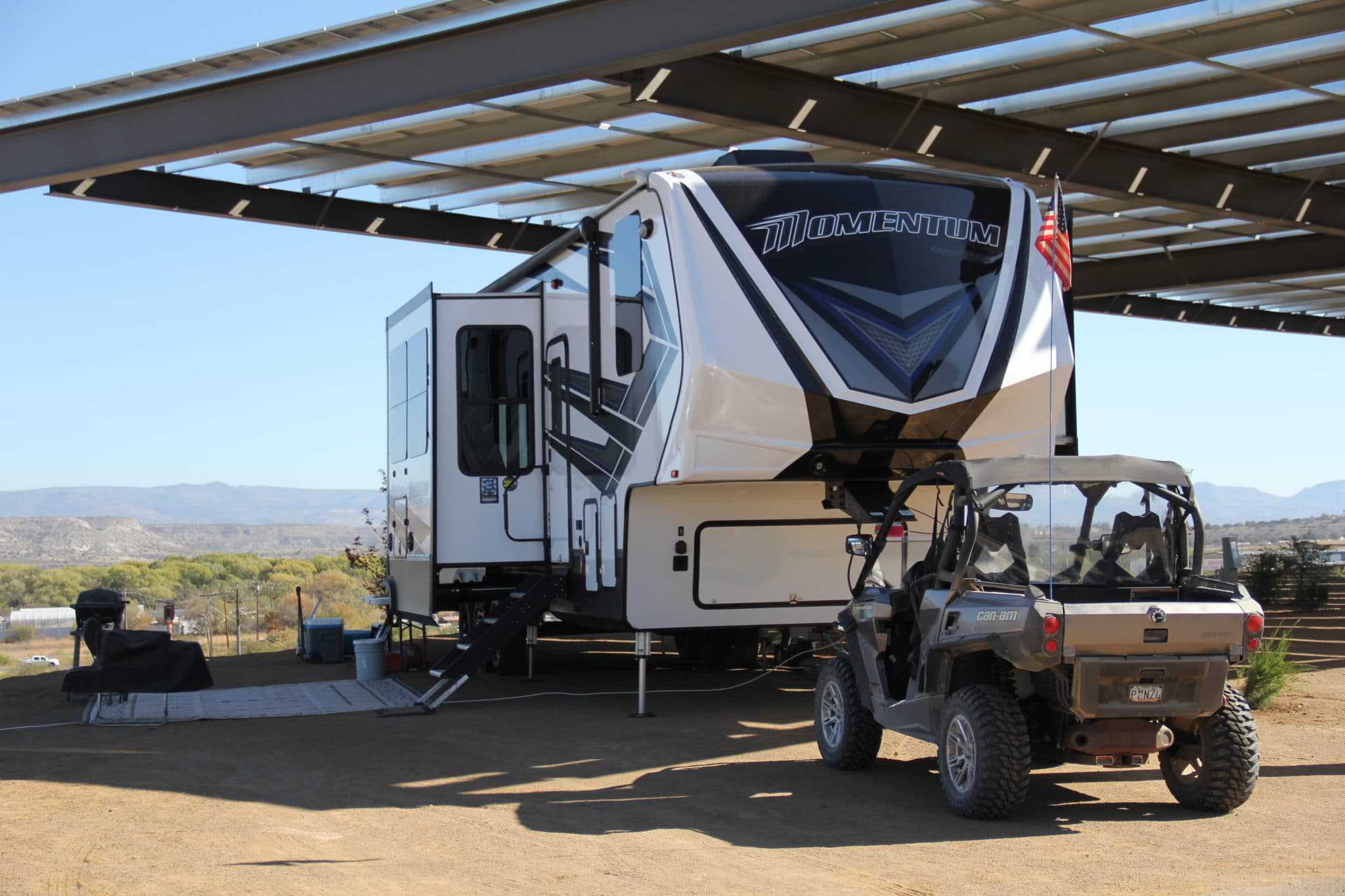 A CRR-rerouted RV with an ATV parked in front of it.