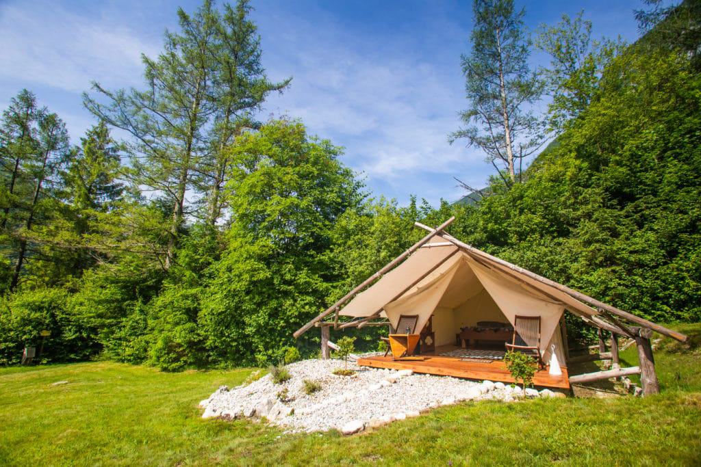 A modern campground nestled in the middle of the woods.
