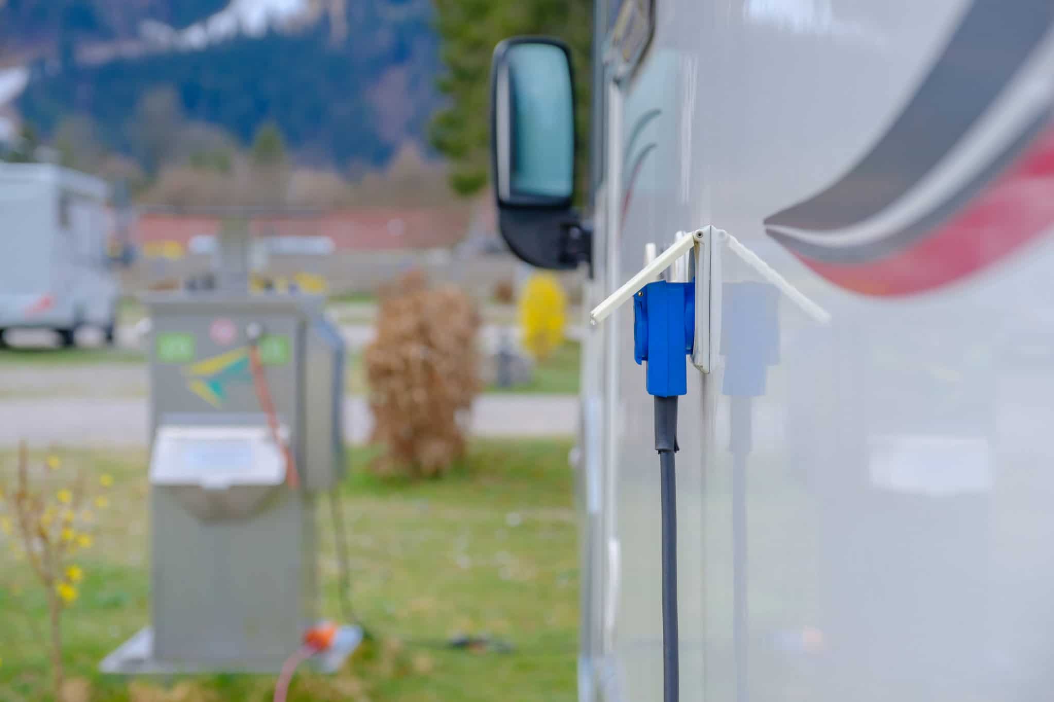 An RV connected to a power outlet at an Australian town's RV rest stop as part of a trial.