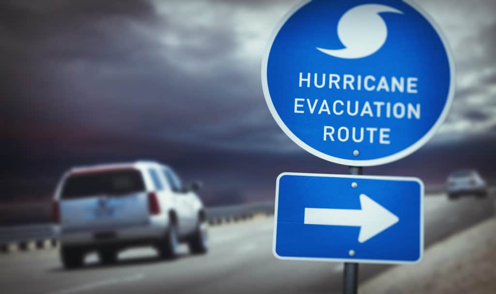 A sign that says hurricane evacuation route in front of a Louisiana Park.