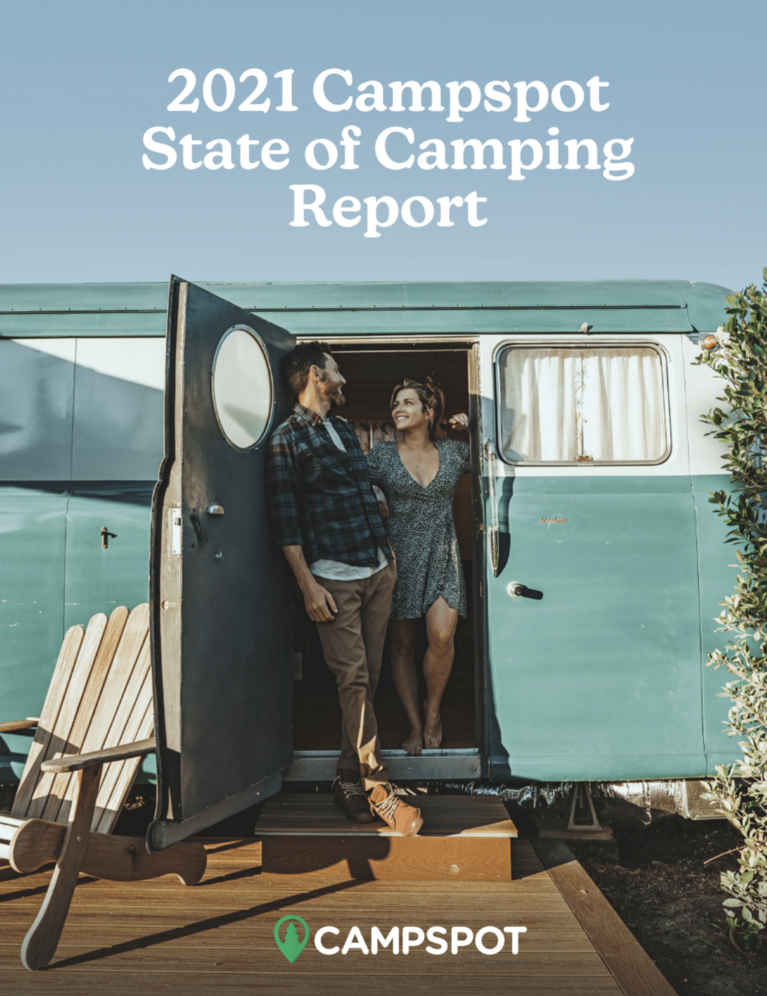 A man and woman standing in a door of a Campspot trailer.