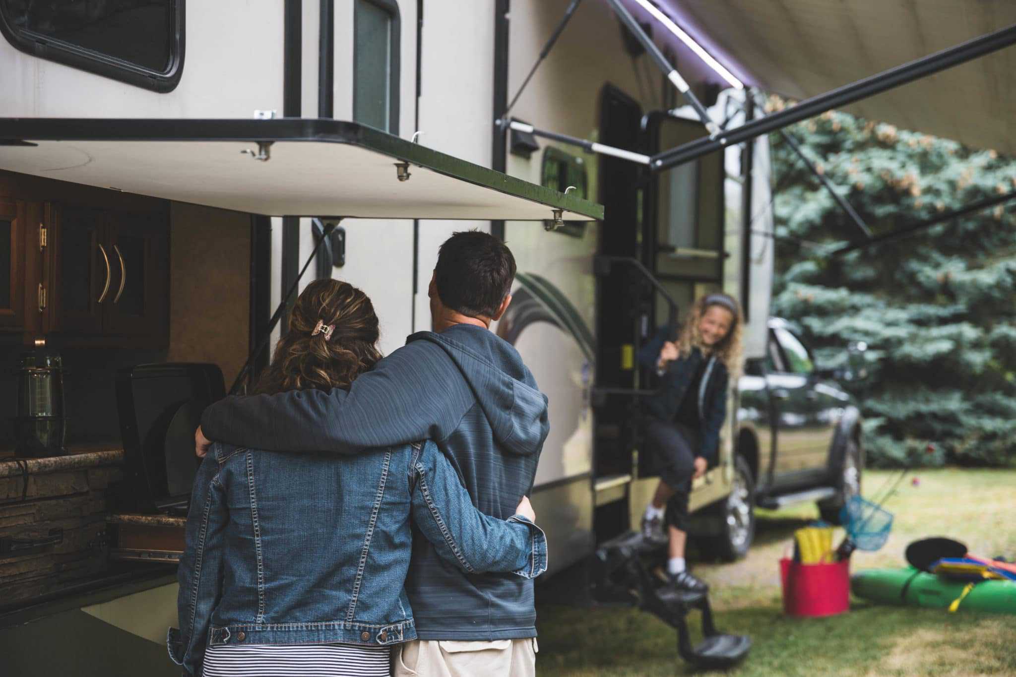 Two Hurricane Ida Victims standing in front of an RV.