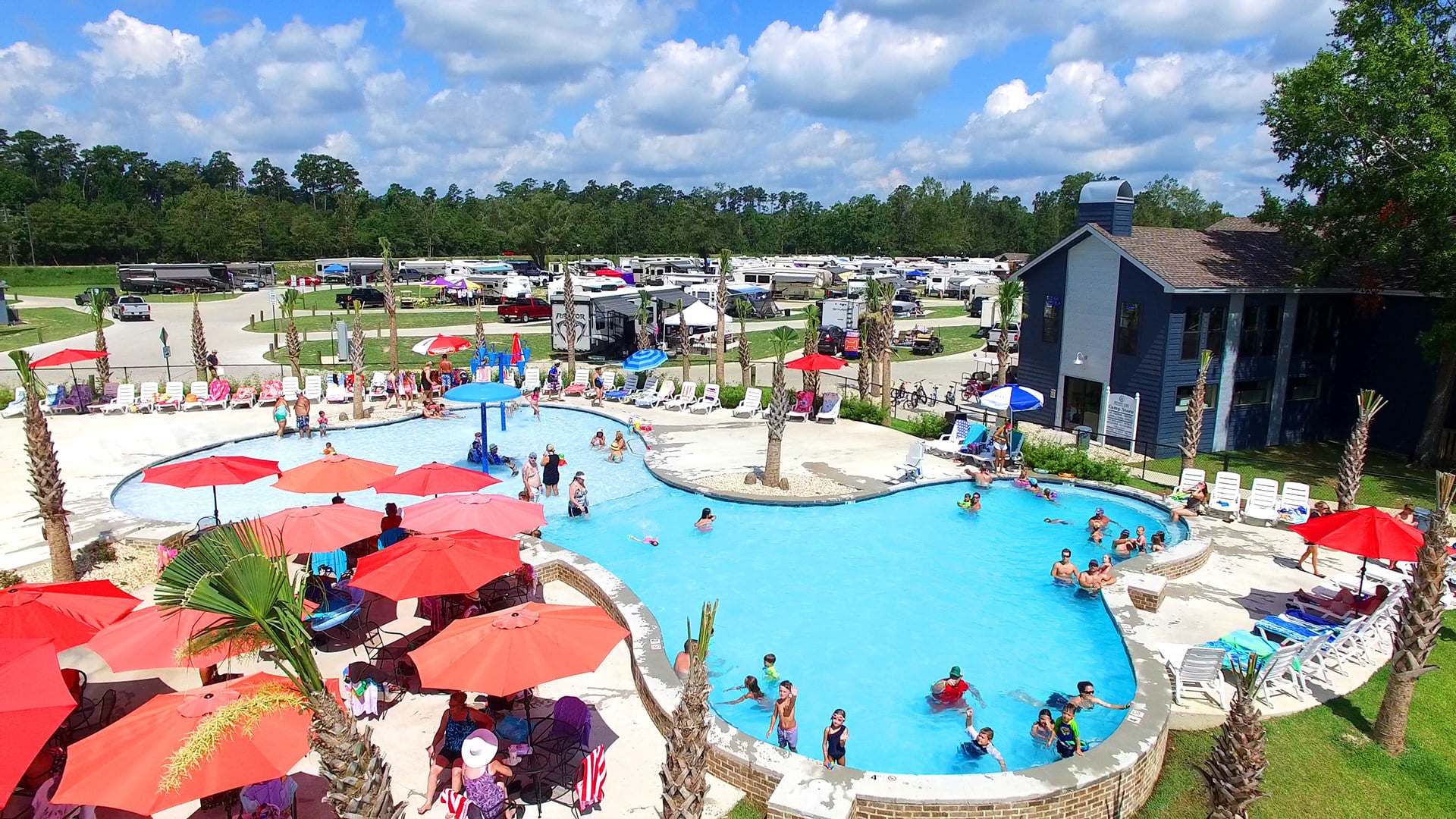 An aerial view of an RV park swimming pool in Louisiana.