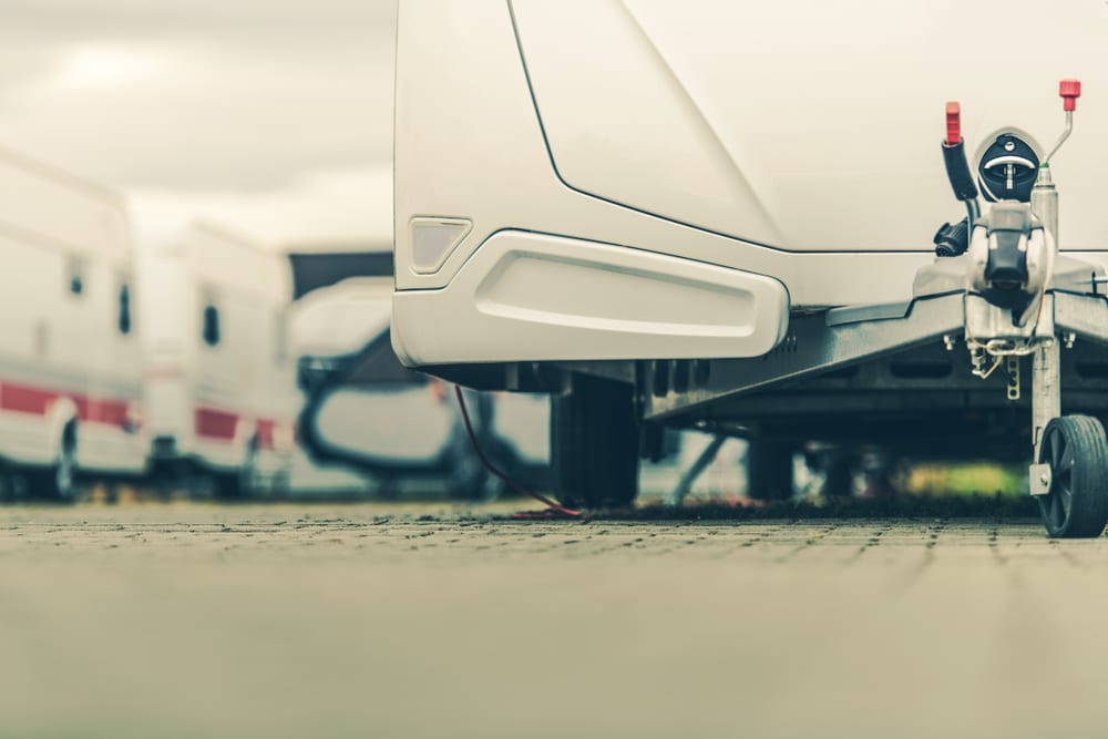 An outdoor RV is parked in a parking lot.