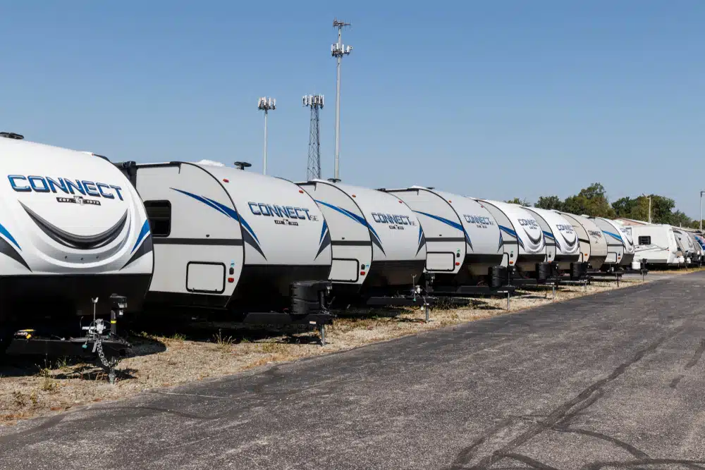 THOR Industries' fiscal 2021 results showcase a lineup of rvs parked in a parking lot.