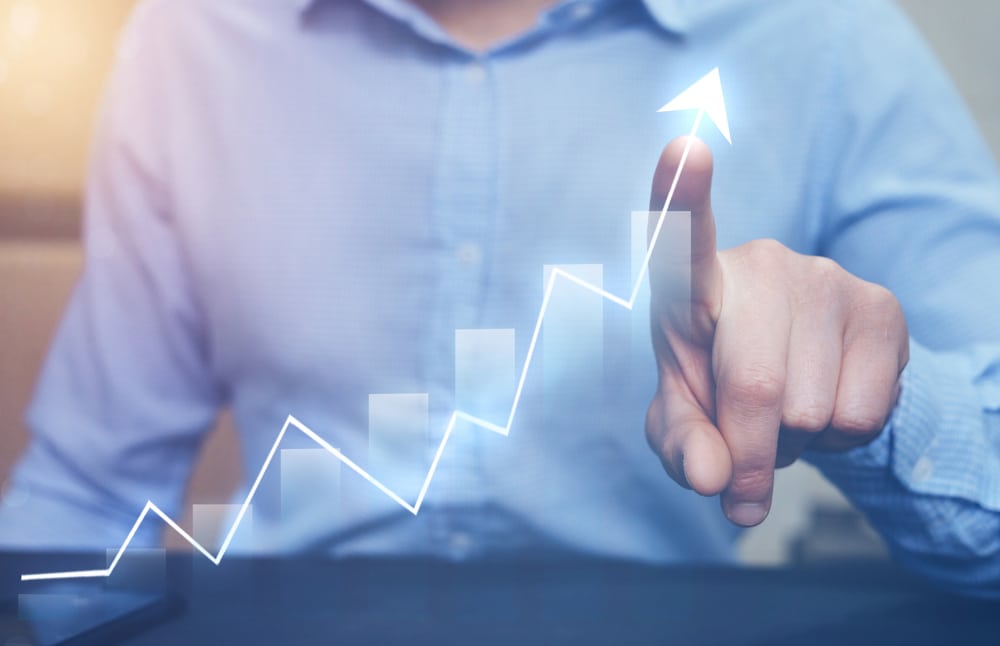 A man is pointing at a graph showing a global opportunity for new research.