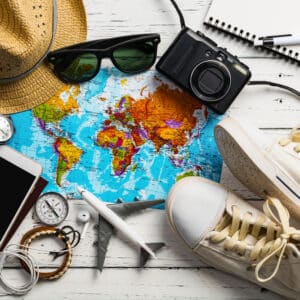 Travel accessories including hat and sunglasses for your Labor Day trip to Florida.
