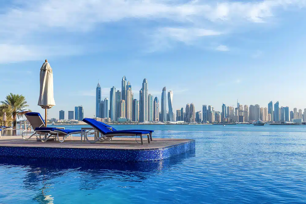 A Glamp with lounge chairs and a view of the city.