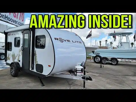 A small RV trailer with the amazing word inside.