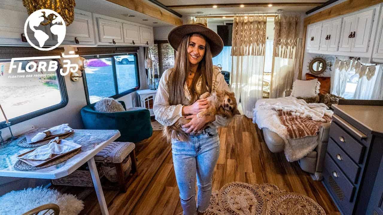 A woman and her dog live in a renovated Class A RV.