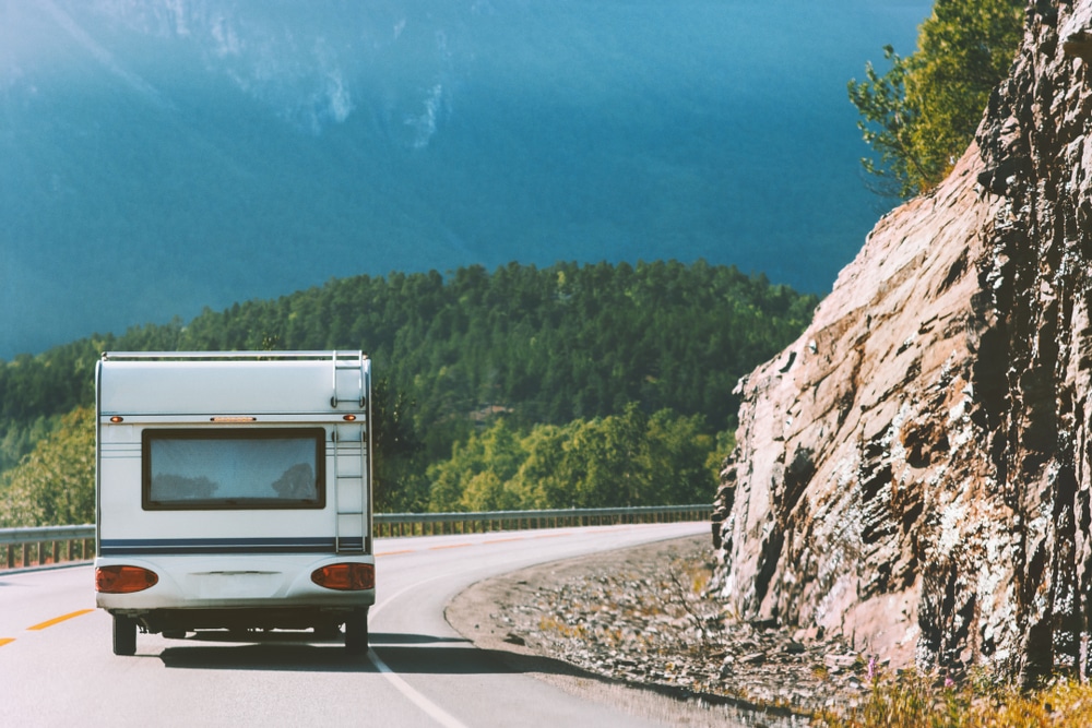 An rv acquires down a mountain road.