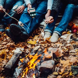 Fall Camping - An Up-Close-And-Personal Look at a Group of People sitting around a campfire in the woods of the Tri-State Area.