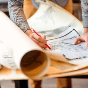 A person is drawing on a piece of paper.