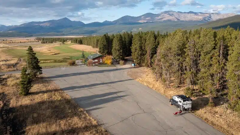 An aerial view of a road with a house in the background, perfect for RVing or holiday travel.