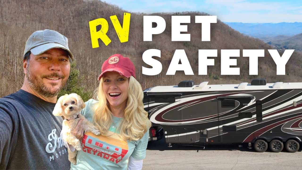 A couple poses in front of their RV, emphasizing the importance of pet safety during travel.