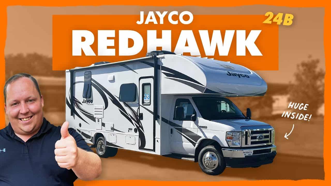 The jayco redhawk rv is shown with a man giving a thumbs up. It offers a Huge Living Area and is Perfect for those seeking a Tiny Class C experience.