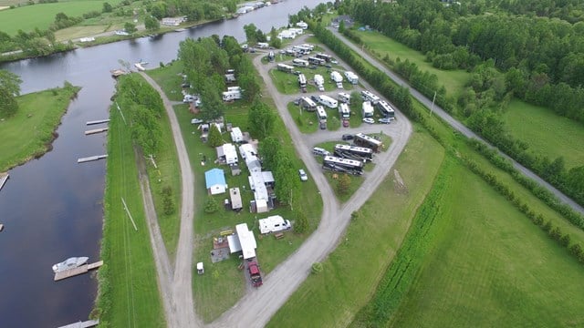 An aerial view of the KOA Award-winning Sturgeon Falls Campground, located near a river.