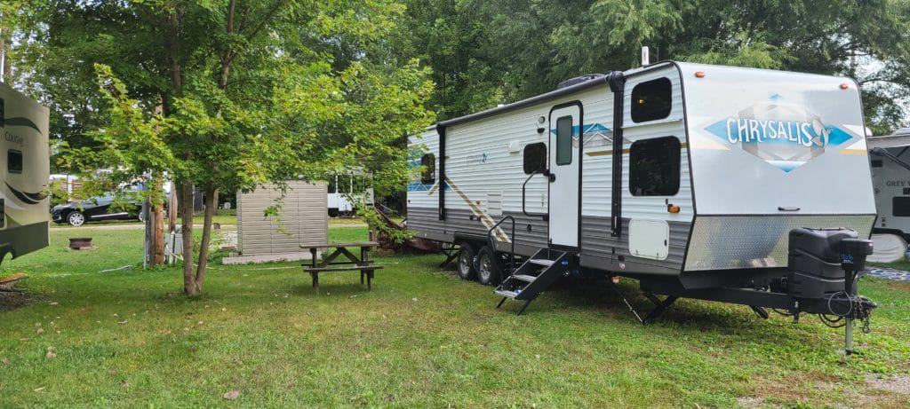 An RVWA-donated small RV parked in a grassy area, benefiting from EasyCare's generous contribution.