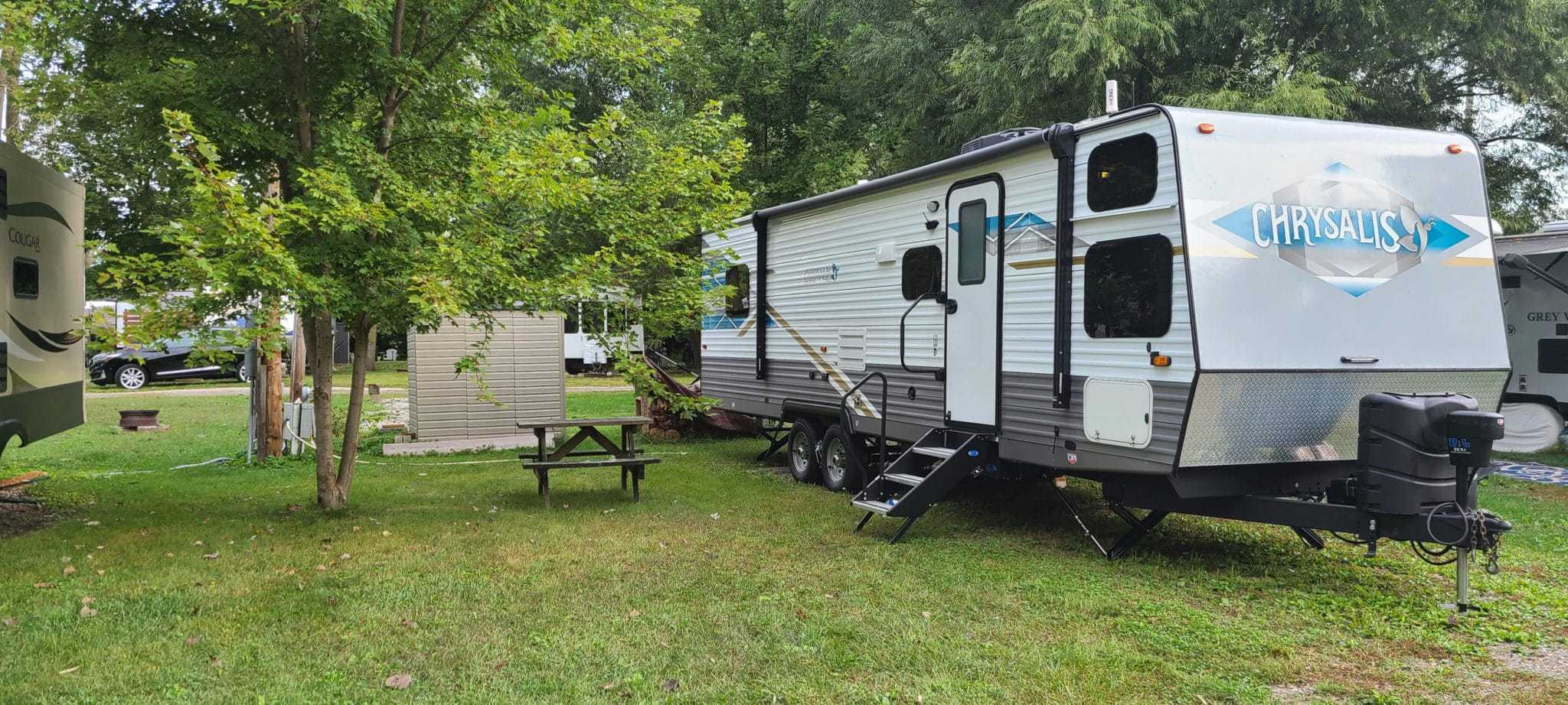 An RVWA-donated small RV parked in a grassy area, benefiting from EasyCare's generous contribution.