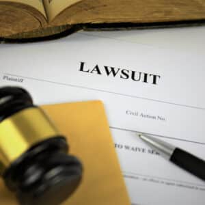 A gavel sits on top of a legal document related to the North Dakota state's operating license for an RV Park.