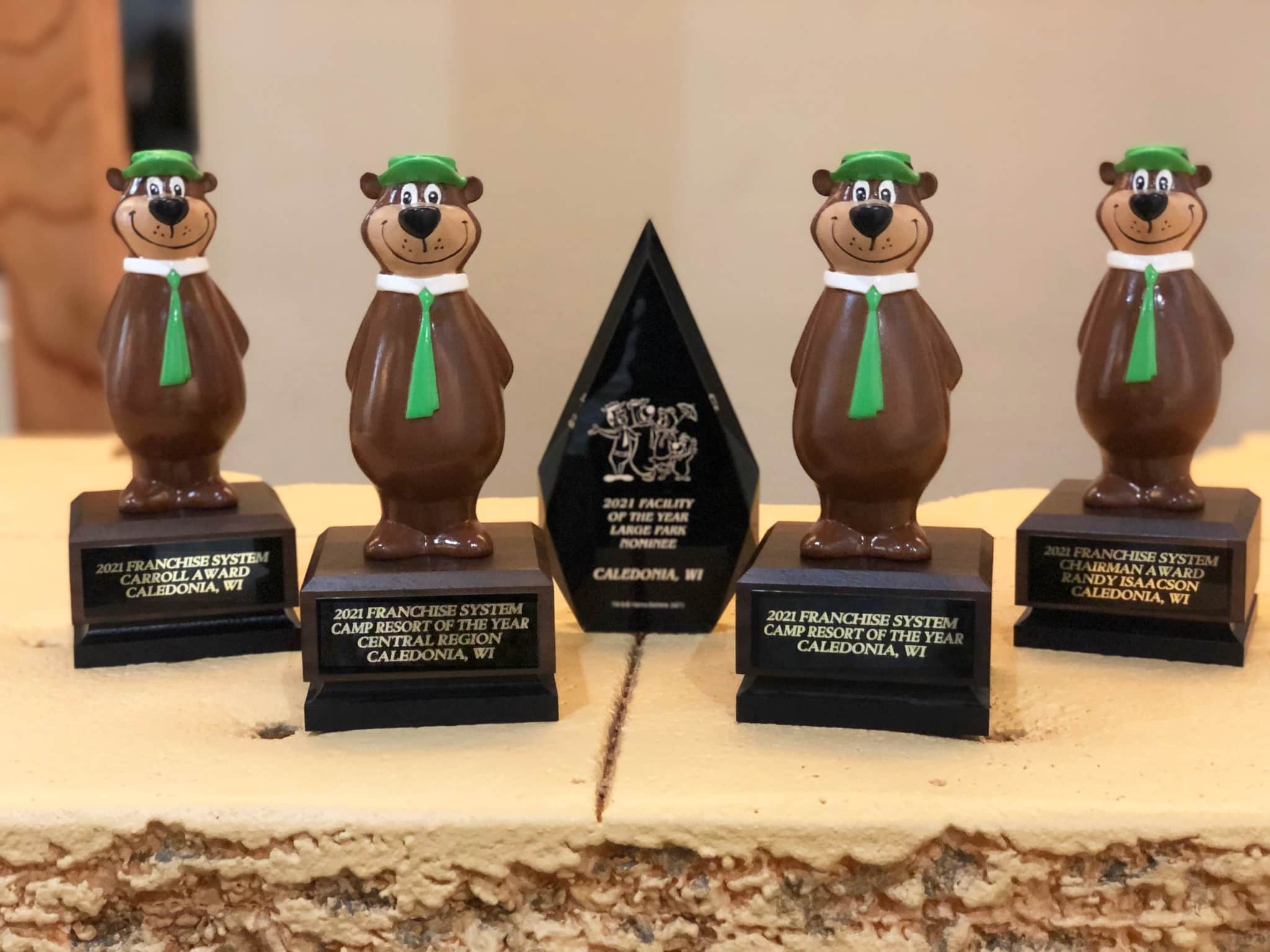 Four chocolate bear trophies on top of a cake at Caledonia Jellystone Park, the 2021 Camp Resort of the Year.