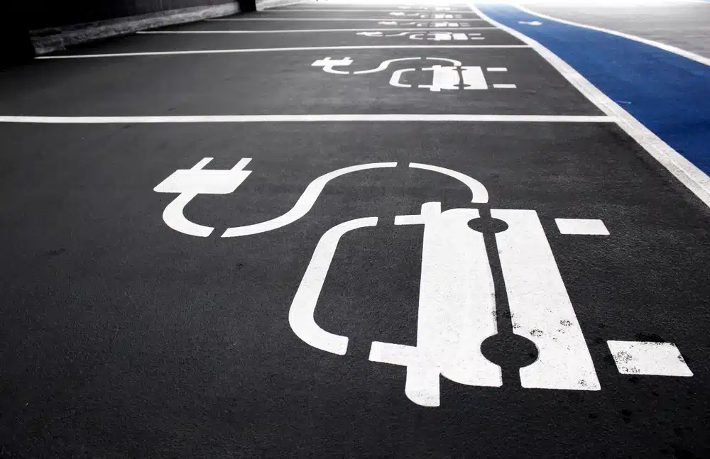 A parking lot with Next-Generation EV Charging Products painted on it.