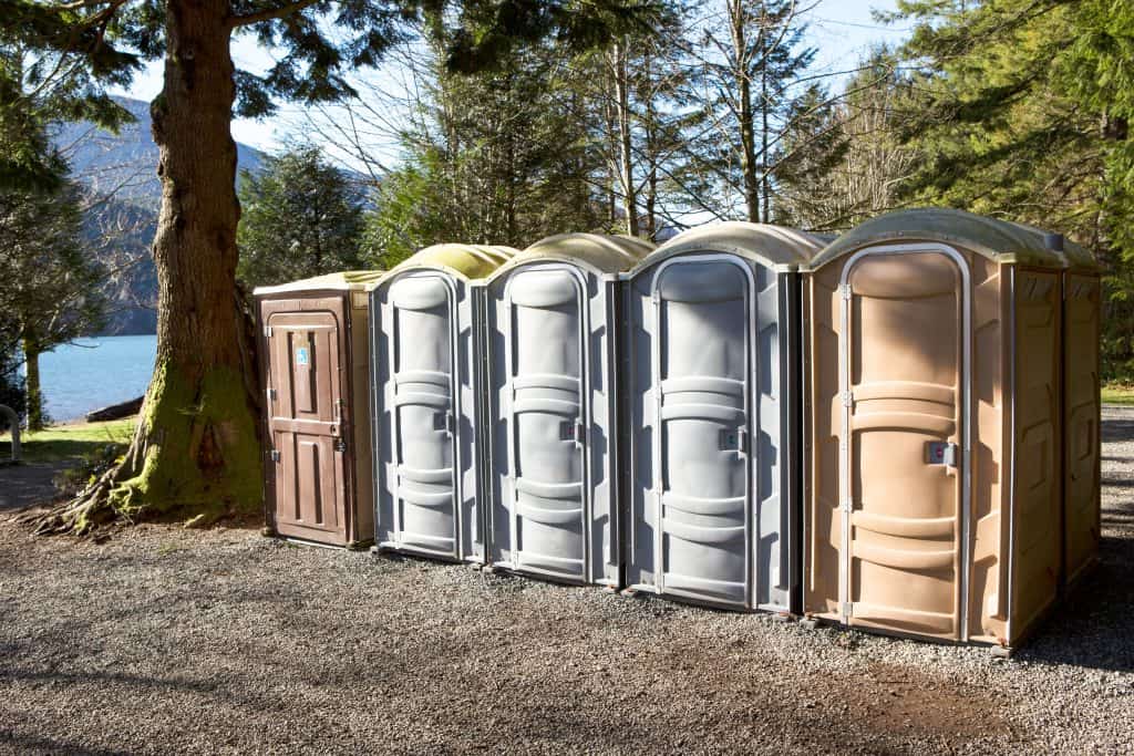 A row of Porta Potty toilets in an Alberta campground.