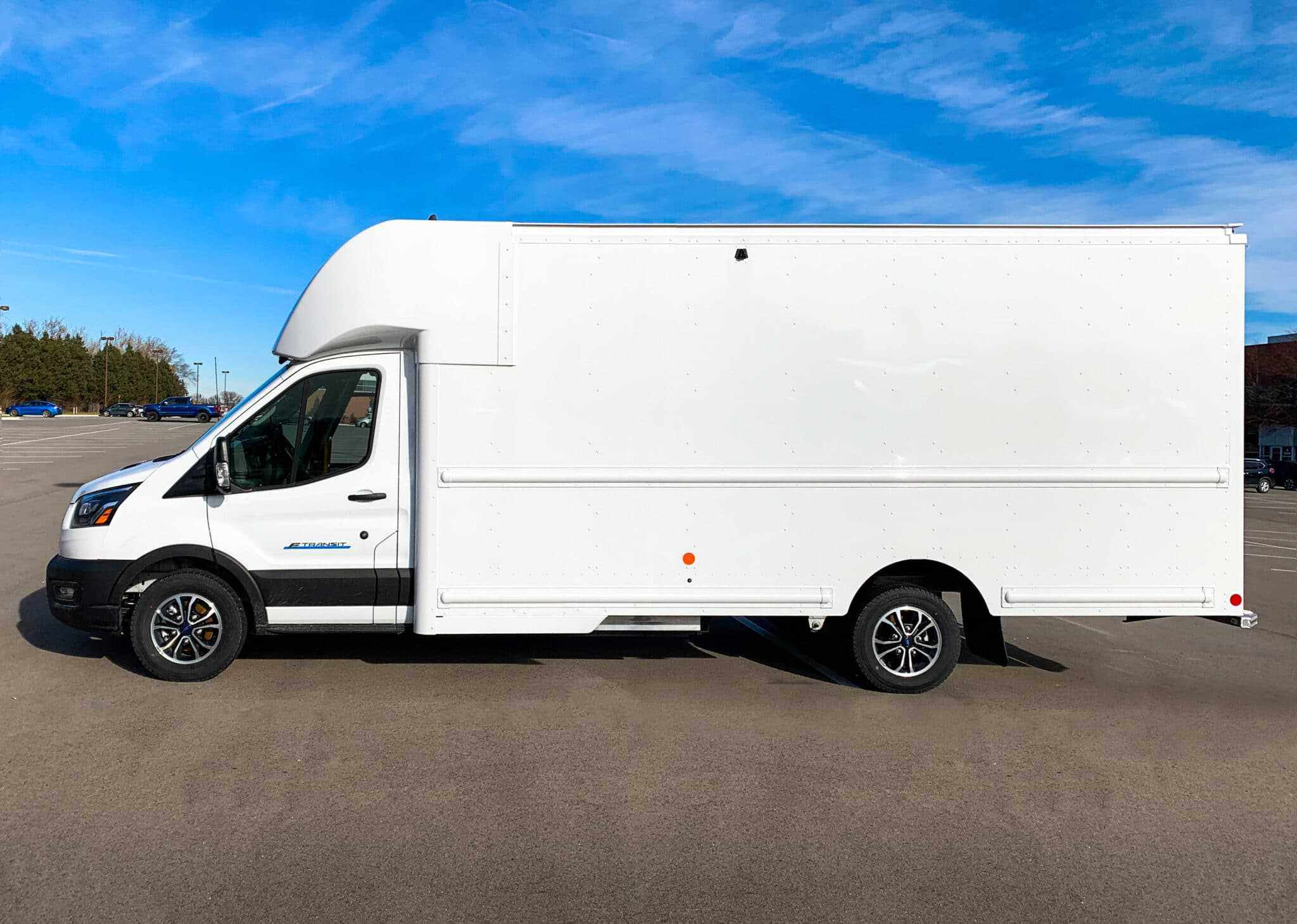 A Utilimaster van parked in a parking lot.