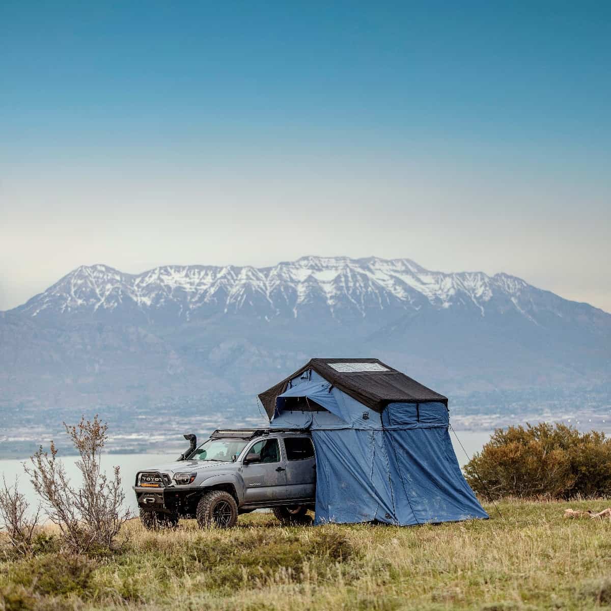 A Toyota pickup truck with a Cascadia Vehicle Tents on top of it.