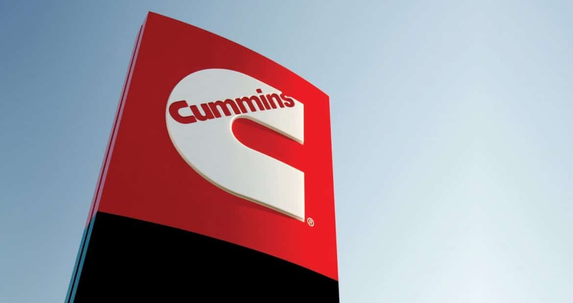 A cummins sign is shown against a blue sky.