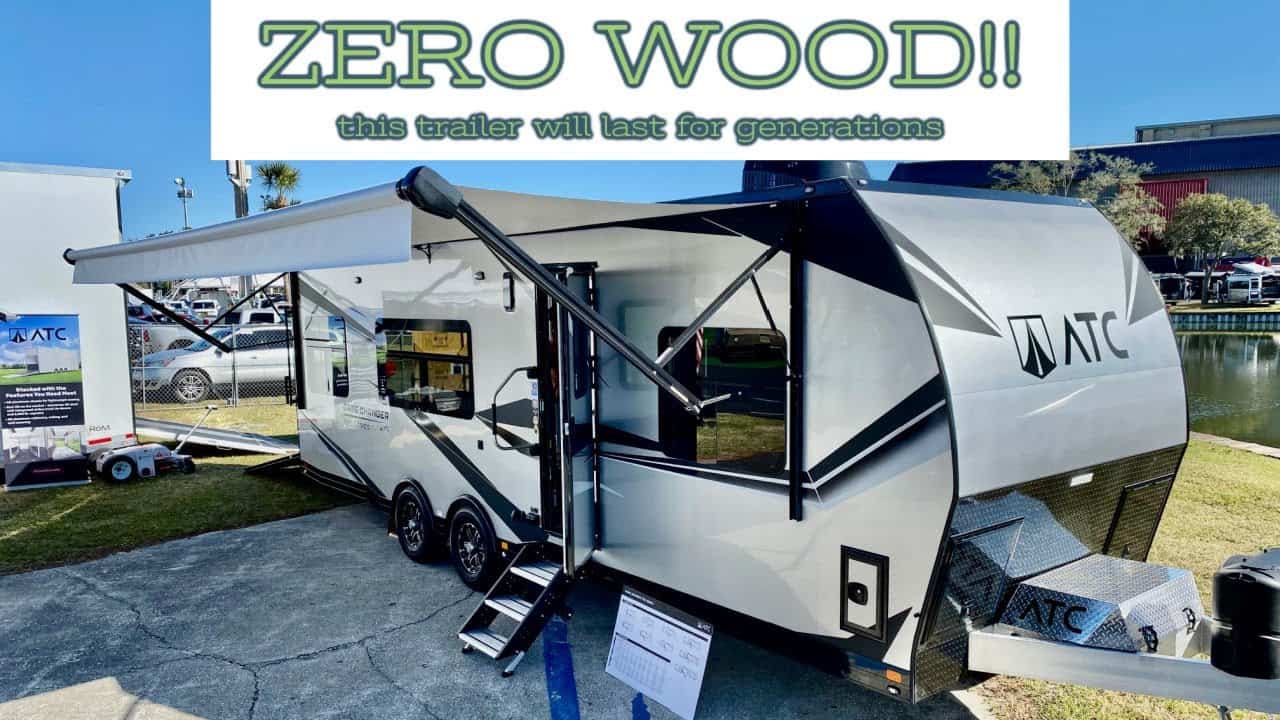 An ATC Game Changer Series RV designed for touring with the words "zero wood" prominently displayed on it.