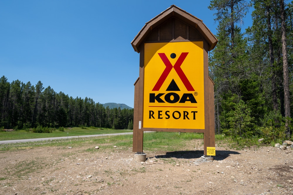 KOA resort sign in front of a serene forest setting, surpassing a record year in SEO.