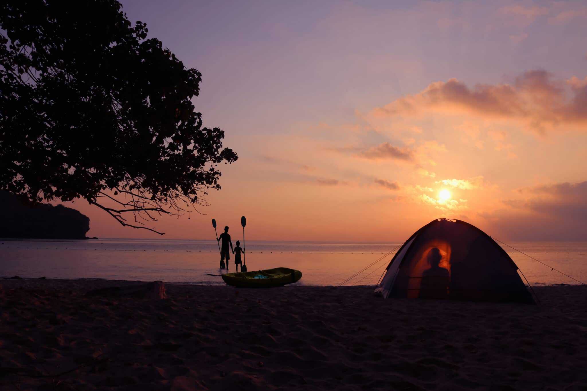 A tent set up at Porpoise Bay Provincial Park beach in British Columbia, creating a picturesque sunset holiday getaway.