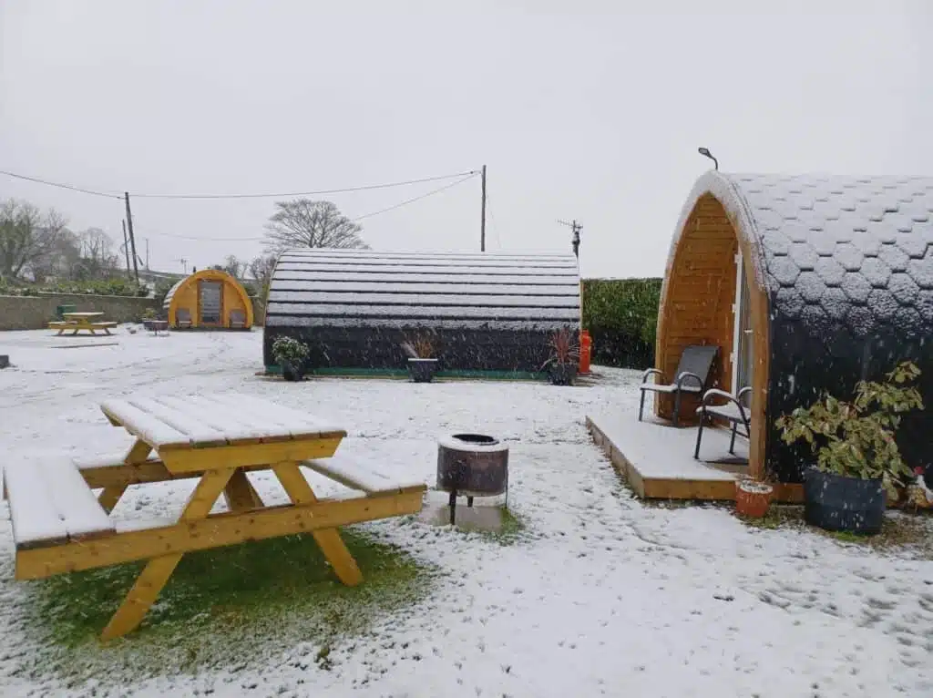 Burntollet Valley, the best glamping site in Northern Ireland offers a serene retreat amidst the snow-covered landscape. Experience the cozy charm of our group of small wooden cabins while enjoying a unique