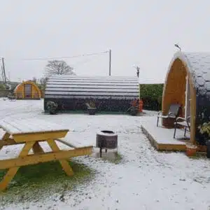 Burntollet Valley, the best glamping site in Northern Ireland offers a serene retreat amidst the snow-covered landscape. Experience the cozy charm of our group of small wooden cabins while enjoying a unique