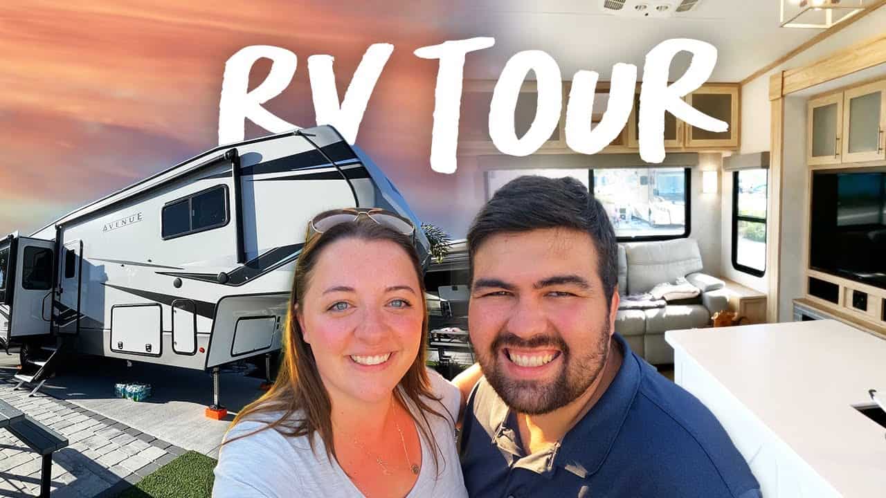 A man and woman standing in front of an rv with the words rv tour.