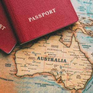 Two passports on top of a map of Australia, perfect for Outback Tourism and Travelers Guide enthusiasts exploring Queensland.