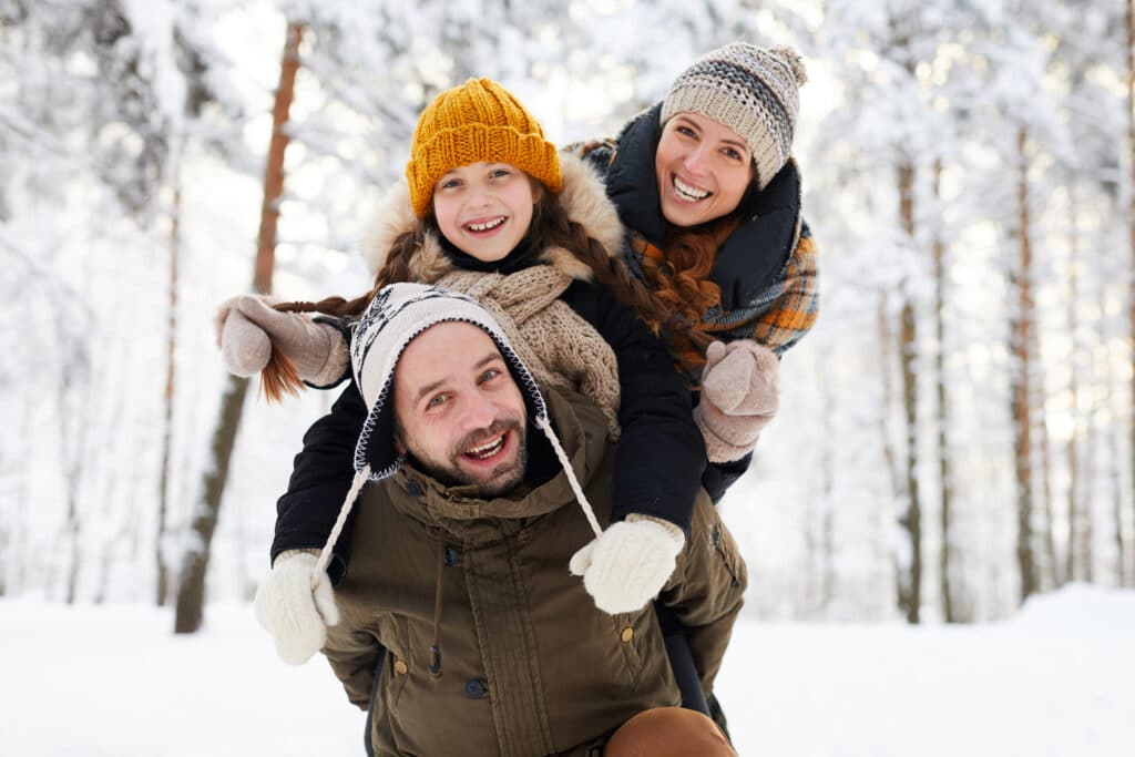 A family is having fun in the snow.