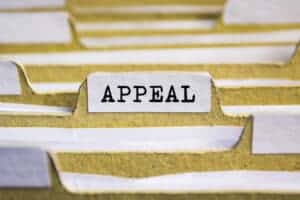 A file folder with the word appeal on it.