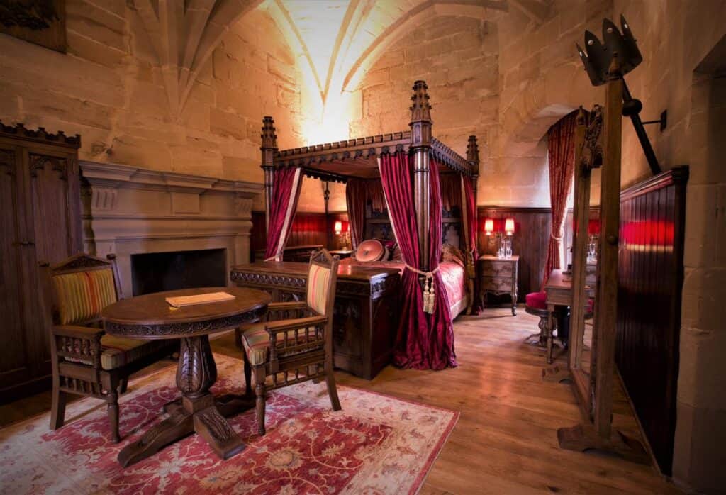 Experience a medieval holiday in a castle room with a luxurious four poster bed.