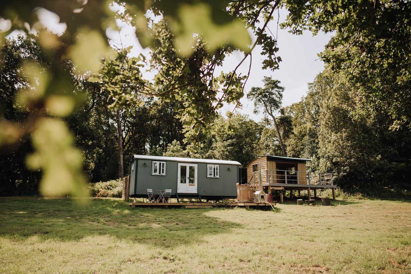 A tiny glamping site sits in the middle of a grassy field in Norfolk, offering a sustainable tourism experience.