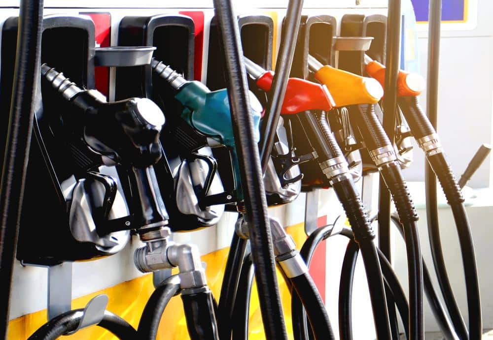 A line of gas pumps at a gas station, representing the higher pump prices amidst war's dark uncertainties.