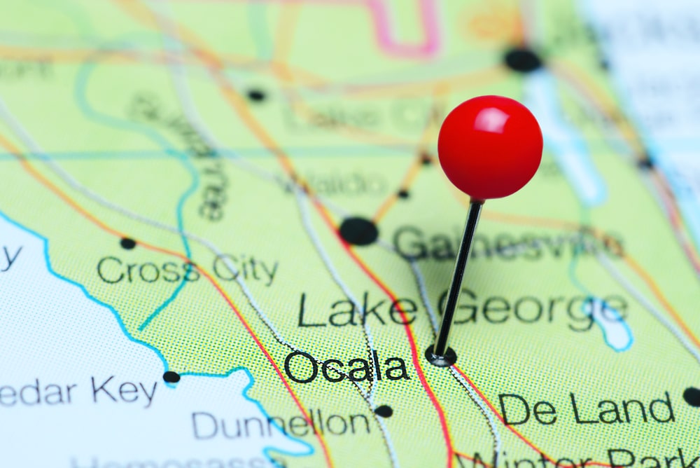 A pin is pinned on a map of Osceola, Florida at Sunlight Resorts.