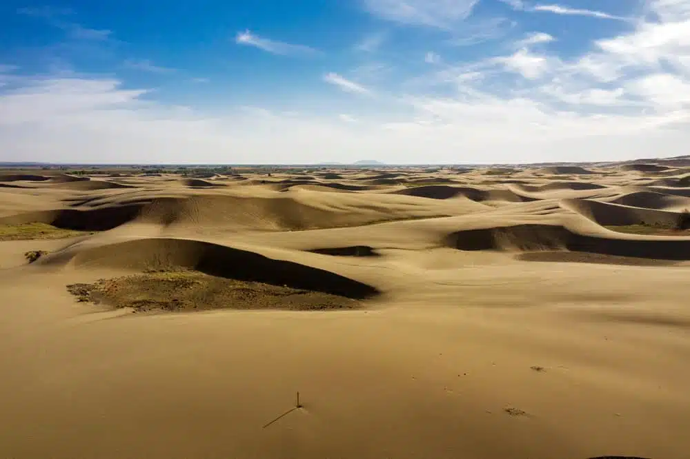 Egin Lakes Campground opens on Saturday with sand dunes in the desert and a blue sky.