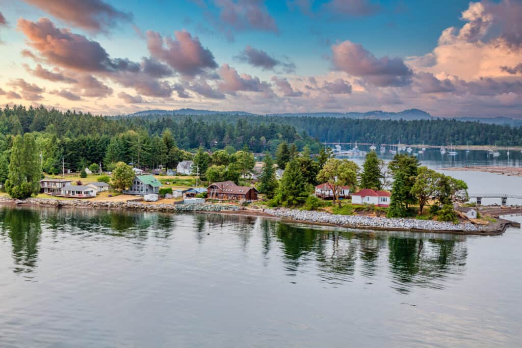 Aerial view of a small island in the Nanaimo Region surrounded by water and trees as part of a survey on Parks and Trails Development.