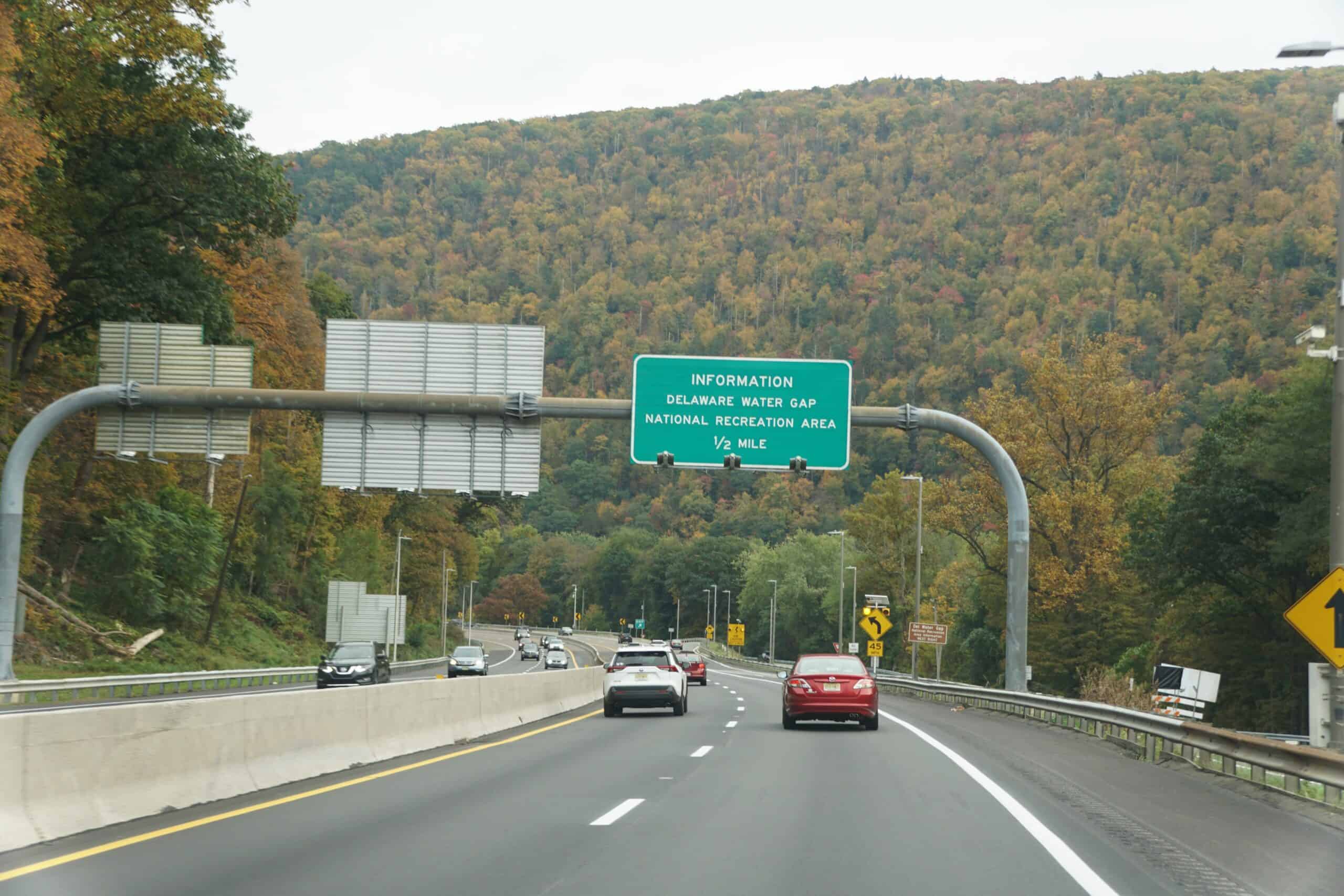 A green sign on the side of a Delaware highway.