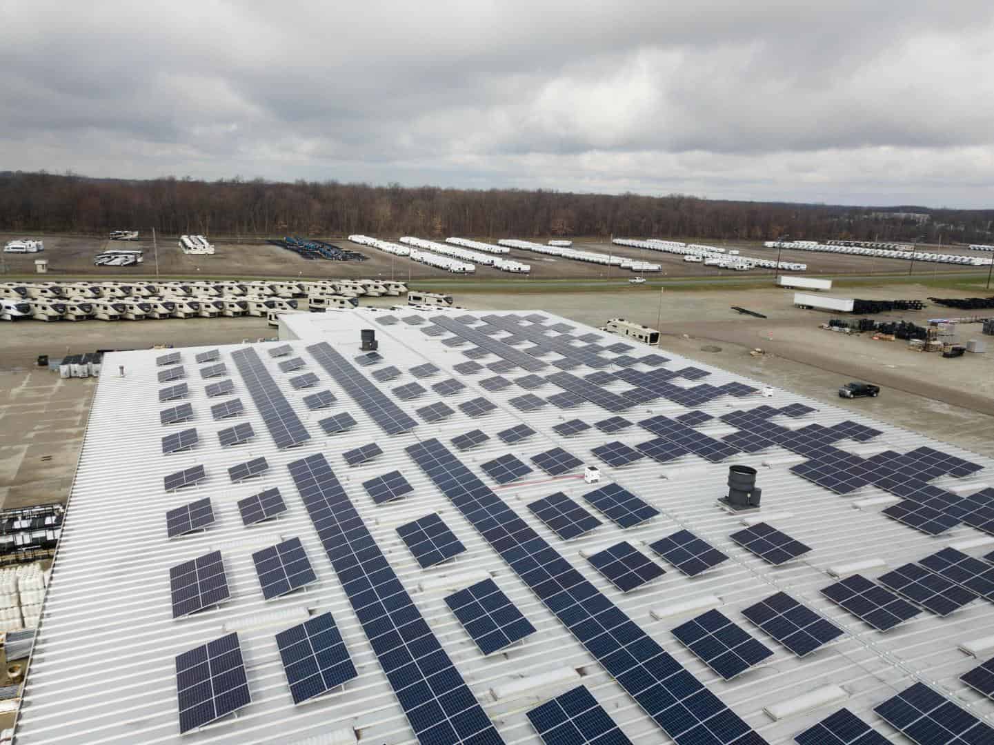 A campus building with solar panels on its roof.