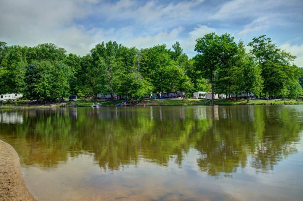 Indian Lakes RV Campground offers the perfect setting for a tranquil getaway, with a serene lake nestled amidst lush trees. Ideal for Memorial Day weekend retreats, this campground provides ample opportunities for relaxation
