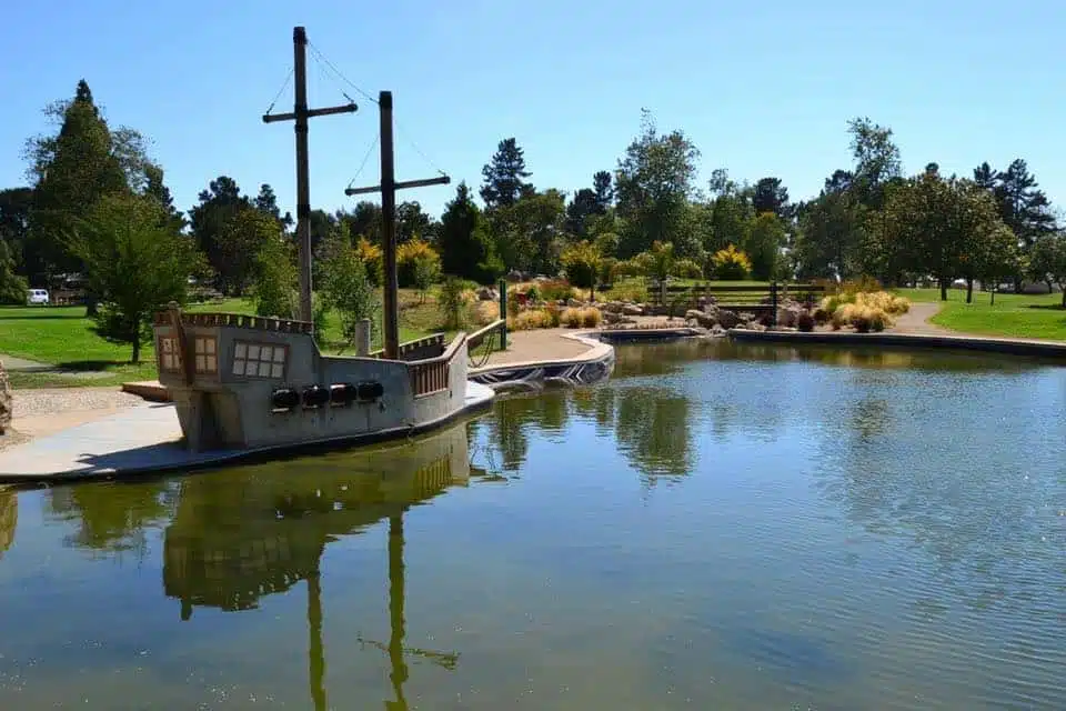 A boat sits in a pond at an outdoor rec grant-funded park in Santa Maria, California.