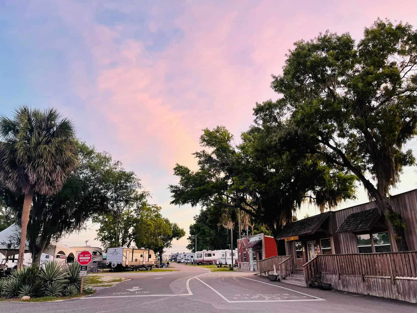 Wildwood RV Village Phase 3 Spruces Up Grounds with Sunset Views of Palm Trees and RVs.